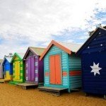 Different colour changing huts on a beach